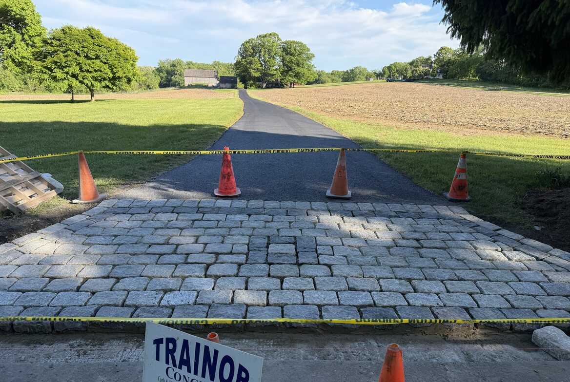 Granite cobblestone driveway apron at the street, freshly set