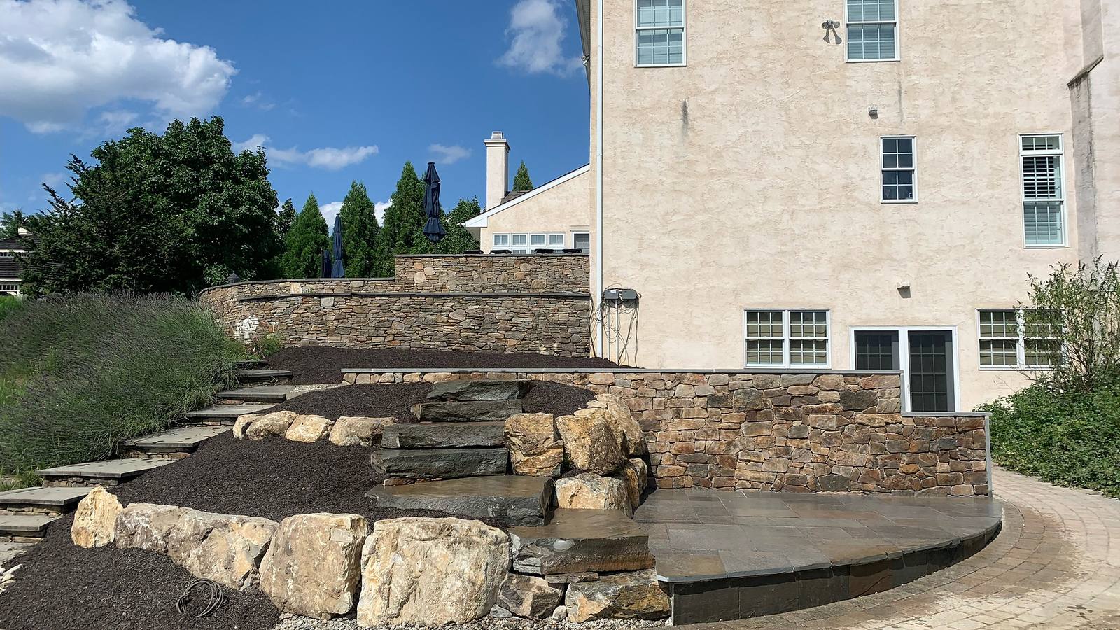 Stone terrace and hardscape completed for a Delaware Valley home