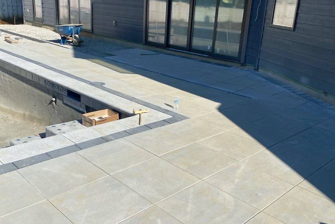 Poolside paver patio installation